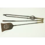 A good set of 3 William IV pierced Gothic Revival brass mounted steel Fire Irons, comprising shovel,