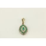 An attractive Ladies gold set cluster diamond and emerald Necklace Drop, of oval form, approx.
