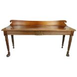 A George III period mahogany Side or Serving Table, probably Irish, the shaped back with scroll