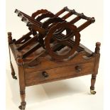 A William IV period mahogany Canterbury, with three X shaped divisions each with turned rails and