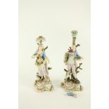 A pair of 19th Century Meissen figural Candlesticks, both as is, one modelled as an elegant