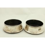 A pair of modern Irish silver Wine Coasters, Dublin c. 1999, each with a Celtic design rim and