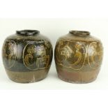 A pair of large early Chinese earthenware and glazed Pots, each with calligraphy design, approx.