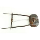 A rare 19th Century Sudanese African four string lyre shape Harp-like musical Instrument, with