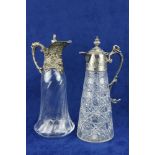 A cutglass Claret Jug, c. 1900, with silver mounted top and handle, 31cms (12") high; together