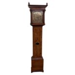 A fine quality walnut Longcase Clock, by Ambrose Moore of Dublin, the moulded cornice with urn