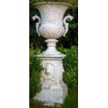 A large heavy set of 2 unusual cast iron Garden Urns, each relief cast with vases of flowers and two