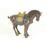 A Chinese cloisonné Tang style model of a Saddled Horse, 31cms x 38cms (12" x 15"). (1)