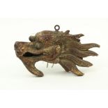 A carved wooden and parcel gilt Dragon Head, Chinese 19th / 20th Century, 26cms (10"). (1)