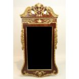 A George II style mahogany and parcel gilt Pier Mirror, with cartouches and leaf crest above a