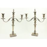 A pair of two branch three light Sheffield silver plated Candelabra, each with leaf cast scroll arms