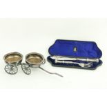 A good silver plated two bottle Wine Wagon, with four spoked wheels and a shaft handle, 15" (38cms),