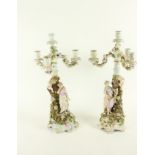 A good pair of Sitzendorf flower encrusted Candelabra, c. 1900, each with three arms and a centre