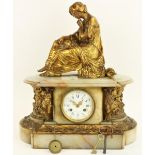 After J. Pradier A French onyx and brass Mantle Clock, surmounted with a seated classical woman,