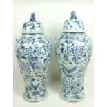 A massive pair of Chinese blue and white porcelain Floor Vases and Covers, each of baluster form,