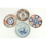 A fine quality 19th Century Imari Plate, with shaped decorated panels and floral bouquet centre, the