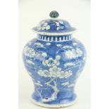 A 19th Century Chinese blue and white bulbous shaped Jar and Cover, decorated with cherry blossom,