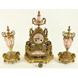 A late 19th Century French gilt metal Mantle Clock Garniture, the clock with a two handled urn