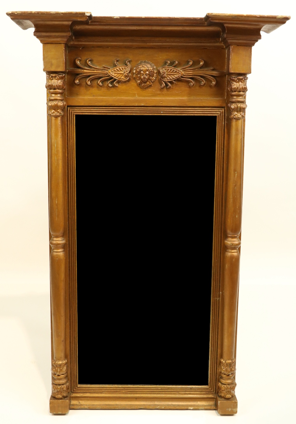 A 19th Century gilt Pier Mirror, the inverted breakfront pediment above a relief moulded frieze with