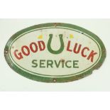 A rare Vintage style enamel Sign, 'Good Luck Service,' of oval form, approx. 31cms x 51cms