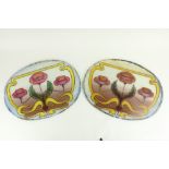 A pair of very attractive Art Nouveau oval stained glass Door Panels, each decorated with flowers,