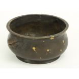 An early heavy bronze Chinese Censor, with gold speckled design, grotesque mask handles, the base