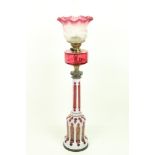 A fine 19th Century Bohemian overlaid white and ruby glass Table Oil Lamp, with brass mounts and