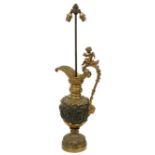 A heavy Neo-Classical style bronze and gilt bronze Ewer, with rustic handles surmounted, a cherub