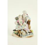 A Meissen porcelain Group, c. 1900, decorated with two seated elegant figures, decorated with