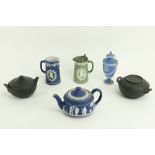 A Wedgwood blue Jasperware Teapot, a similar portrait Jug, a green Jasperware Hot Water Pot, a light