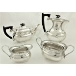 A four piece silver Tea and Coffee Service, Sheffield 1948, comprising coffee pot, teapot, sugar