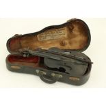 A cased 19th Century miniature Violin, with bow, inscribed on old label attached, 9 1/2" (24cms). (