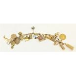 An attractive gold Charm Bracelet, with 21 charms, including a shield back half sovereign (1832),