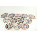 A set of four 19th Century Imari 'fan' design landscape Plates, decorated with birds, flowers and