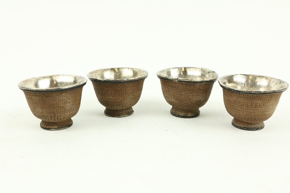 A set of 4 cased Chinese basket weave bound white metal Tea Bowls, 7.5cms (3"). (4)