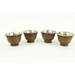 A set of 4 cased Chinese basket weave bound white metal Tea Bowls, 7.5cms (3"). (4)