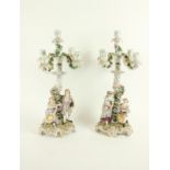 A pair of Sitzendorf porcelain flower encrusted four branch five-light Candelabra, each with an