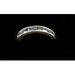 A Channel Set platinum Eternity sapphire Ring, set with .06 x 15 = 1.5 tcw, size J. (1)