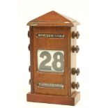 A late Victorian Desk Calendar, modelled as a Post Box with three panels, approx. 24cms high x 13cms