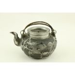 A 19th Century pewter Chinese Teapot, of bulbous form with engraved ornate silvered overlay