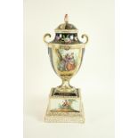 An atractive Dresden Urn and Cover, decorated with colourful flowers and figures against black and