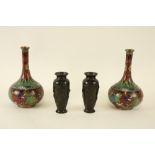 A pair of small Japanese bronze Vases, with birds and foliage in relief, 15cms (6"); and a pair of