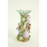 A Sitzendorf porcelain Table Centre, with Asian mother and child around a flower encrusted tree,