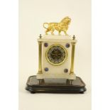 A late 19th Century French onyx and gilt metal Mantle Clock, of architectural design surmounted with
