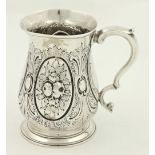 A George III chased silver baluster shaped Tankard, London 1758 by Thos. Wright, chased with fruit