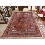 A fine quality 19th Century Middle Eastern woollen Carpet, the central panel with large floral