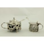 An ornate Victorian silver Mustard, in the rococo style, with leaf cast handle and hinged cover,