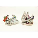 Two similar German porcelain Groups, 20th Century, one modelled with an elegant couple playing