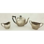 A three piece silver Tea Service, by Walker and Hall, Sheffield c. 1918, comprising an oval half