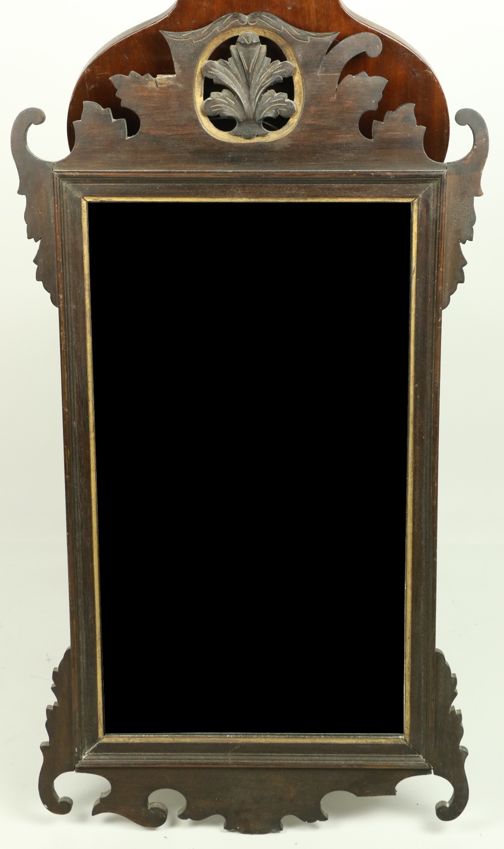 A 19th Century mahogany upright Mirror, with pierced and carved leaf decoration and bevelled mirror,